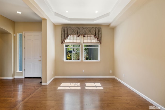 1745 Hunter Creek Rd, Reno, NV 89519 - spare room featuring wood finished floors, a raised ceiling, arched walkways, baseboards, and recessed lighting