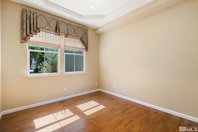 1745 Hunter Creek Rd, Reno, NV 89519 - empty room with wood finished floors, baseboards, and a tray ceiling