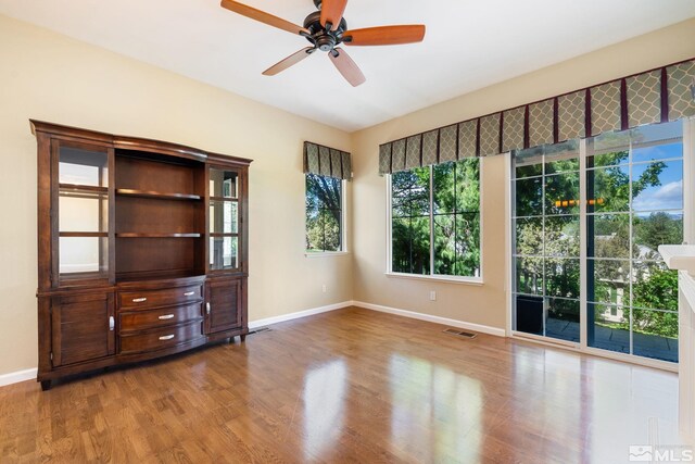 1745 Hunter Creek Rd, Reno, NV 89519 - unfurnished room with baseboards, wood finished floors, and a ceiling fan