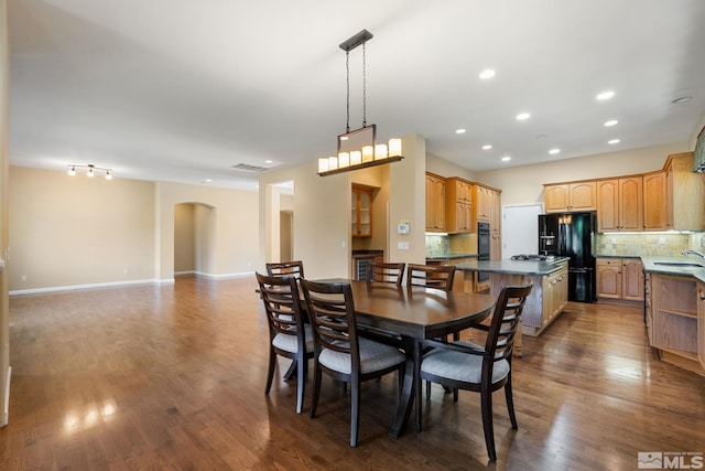 1745 Hunter Creek Rd, Reno, NV 89519 - dining room with arched walkways, dark wood finished floors, recessed lighting, and baseboards