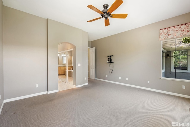 1745 Hunter Creek Rd, Reno, NV 89519 - unfurnished bedroom featuring carpet, arched walkways, baseboards, and ensuite bath