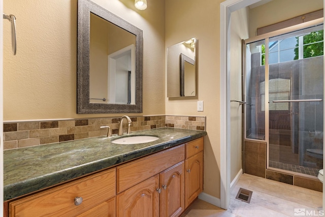 1745 Hunter Creek Rd, Reno, NV 89519 - full bath featuring vanity, a stall shower, decorative backsplash, and tile patterned floors