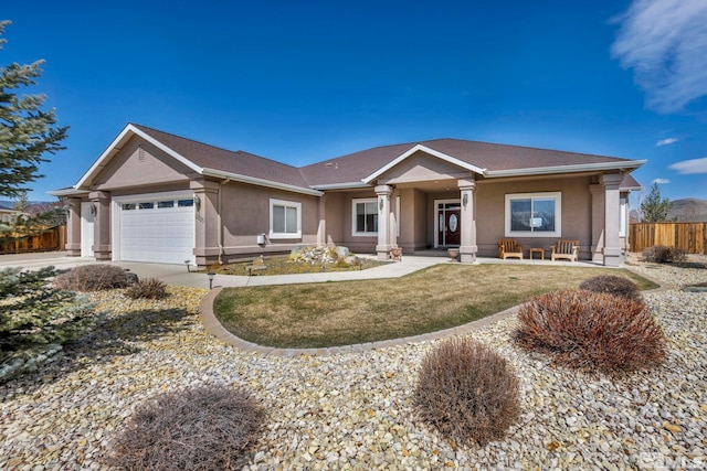 2825 N Fork Ln, Minden, NV 89423 - ranch-style home featuring stucco siding, covered porch, a garage, and concrete driveway