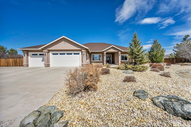 2825 N Fork Ln, Minden, NV 89423 - ranch-style house with fence, stucco siding, an attached garage, and concrete driveway