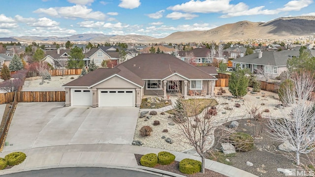 2825 N Fork Ln, Minden, NV 89423 - view of front facade with a residential view, a mountain view, and a garage