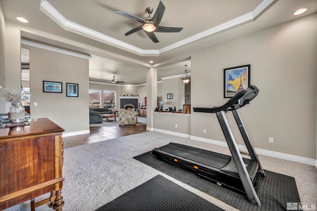 2825 N Fork Ln, Minden, NV 89423 - exercise area featuring a ceiling fan, a tray ceiling, ornamental molding, carpet floors, and baseboards