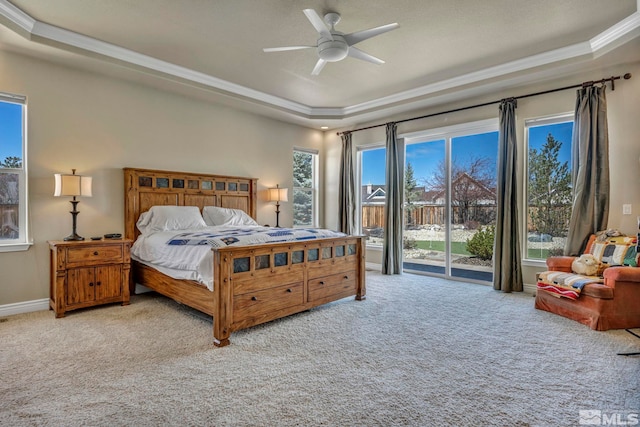 2825 N Fork Ln, Minden, NV 89423 - carpeted bedroom with a tray ceiling, access to exterior, ornamental molding, ceiling fan, and baseboards
