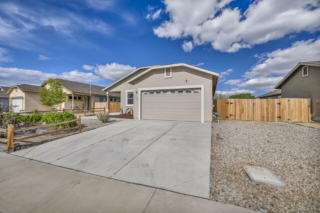 1282 Onda Verde Dr, Fallon, NV 89406 - single story home with concrete driveway, fence, a gate, a garage, and stucco siding