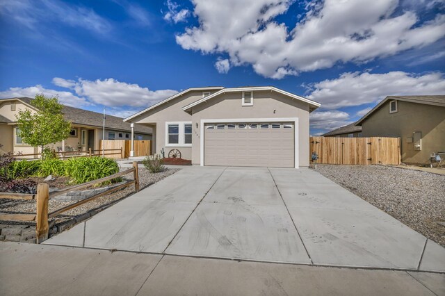1282 Onda Verde Dr, Fallon, NV 89406 - single story home with stucco siding, concrete driveway, fence, and a garage