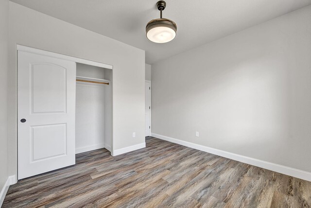 1282 Onda Verde Dr, Fallon, NV 89406 - unfurnished bedroom featuring wood finished floors, baseboards, and a closet