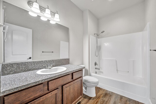 1282 Onda Verde Dr, Fallon, NV 89406 - full bath featuring wood finished floors, bathtub / shower combination, vanity, and toilet