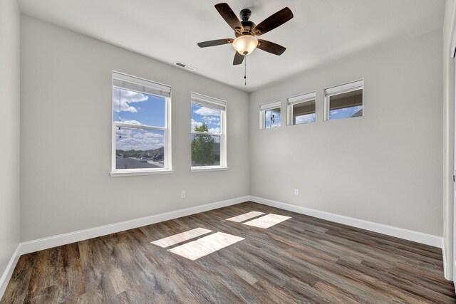 1282 Onda Verde Dr, Fallon, NV 89406 - empty room featuring dark wood-style floors, a ceiling fan, and baseboards
