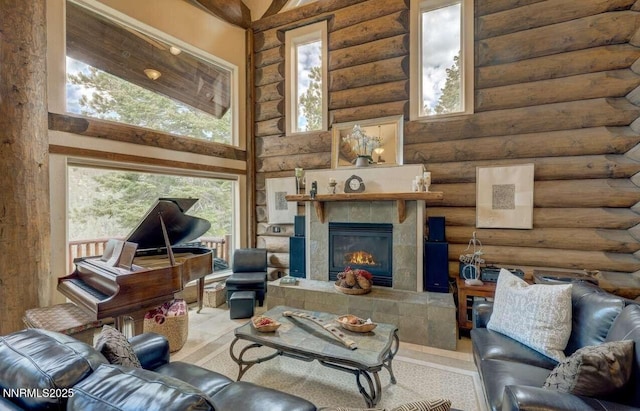 996 Tyner Way, Incline Village, NV 89451 - living room featuring log walls, healthy amount of natural light, a fireplace, and a high ceiling