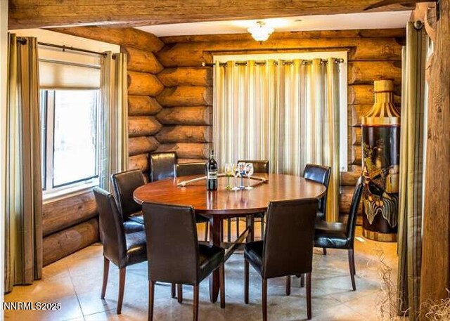 996 Tyner Way, Incline Village, NV 89451 - dining space with log walls, beamed ceiling, and light tile patterned floors