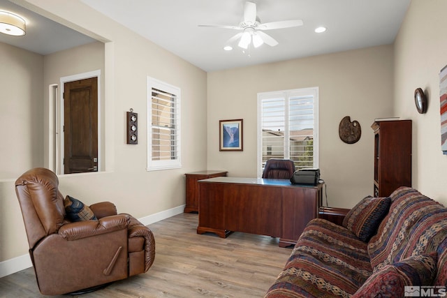 office area featuring light wood-style floors, a ceiling fan, baseboards, and recessed lighting