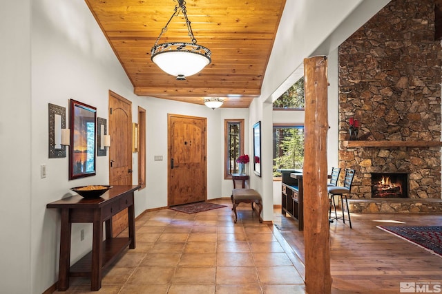671 14th Green Dr, Incline Village, NV 89451 - foyer entrance featuring wood ceiling, high vaulted ceiling, baseboards, and a fireplace