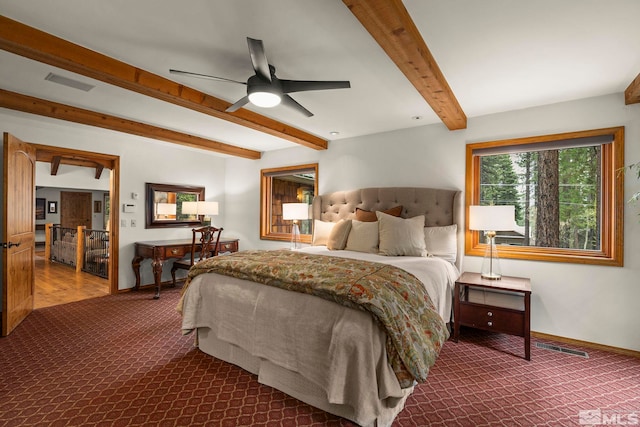 671 14th Green Dr, Incline Village, NV 89451 - bedroom with dark carpet, beamed ceiling, baseboards, and a ceiling fan