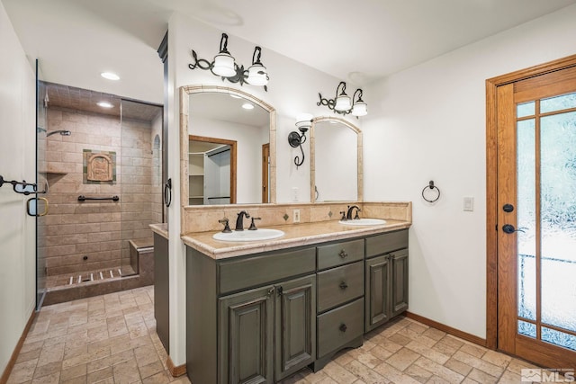 671 14th Green Dr, Incline Village, NV 89451 - bathroom featuring a shower stall, double vanity, baseboards, and recessed lighting