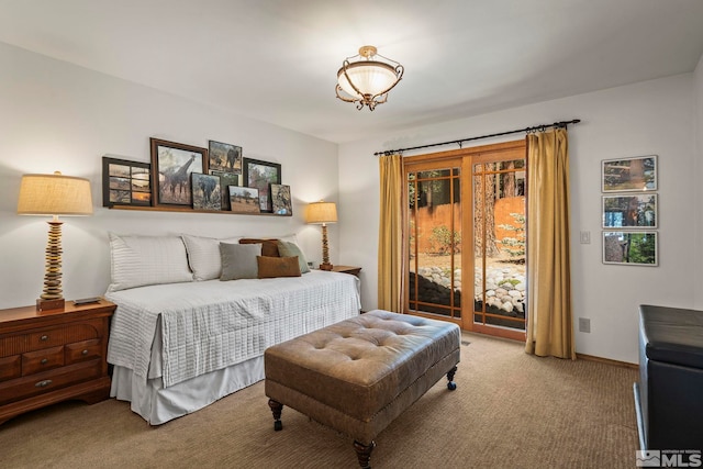 671 14th Green Dr, Incline Village, NV 89451 - bedroom featuring carpet flooring, access to outside, and a chandelier