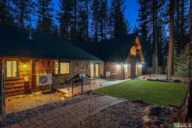 671 14th Green Dr, Incline Village, NV 89451 - rear view of house with ac unit, a yard, a wooden deck, french doors, and roof with shingles
