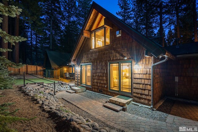 671 14th Green Dr, Incline Village, NV 89451 - back of house with fence and a patio area