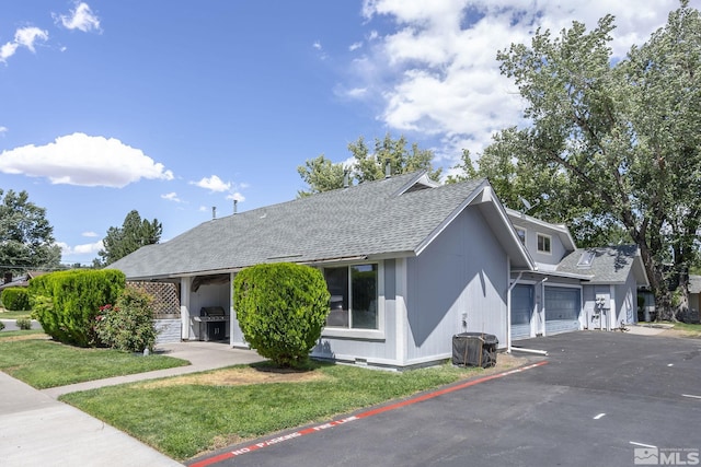 2390 Oppio, Sparks, NV 89431 - view of front of property with a shingled roof, driveway, and a front yard