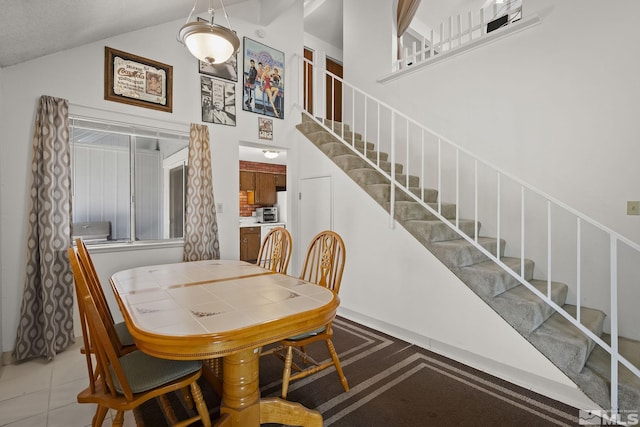 2390 Oppio, Sparks, NV 89431 - dining area featuring stairs and high vaulted ceiling