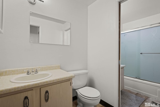 2390 Oppio, Sparks, NV 89431 - bathroom featuring toilet, vanity, and shower / bath combination with glass door