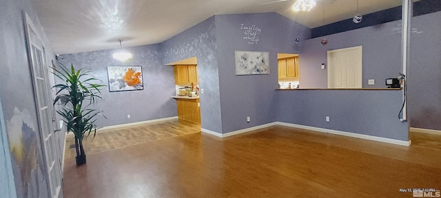 195 Monumental Cir, Sparks, NV 89436 - unfurnished room featuring wood finished floors, lofted ceiling, ceiling fan, and baseboards