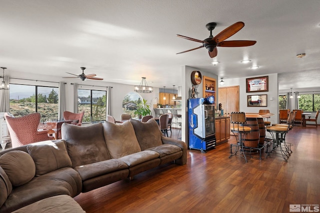 3075 Markridge Dr, Reno, NV 89509 - living area featuring a ceiling fan, dark wood-style floors, and a chandelier