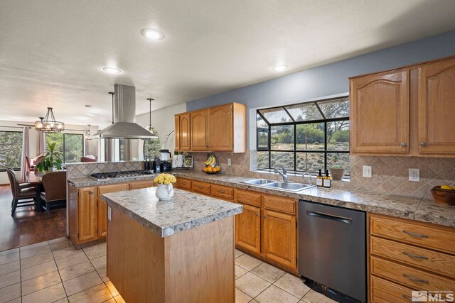 3075 Markridge Dr, Reno, NV 89509 - kitchen with stainless steel appliances, a sink, island range hood, a peninsula, and a kitchen island