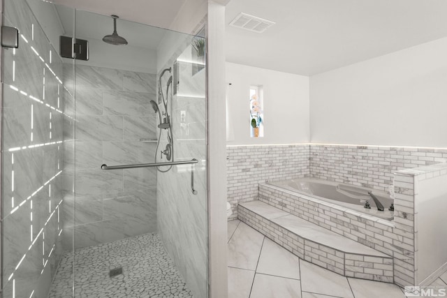 3075 Markridge Dr, Reno, NV 89509 - bathroom featuring a garden tub, a shower stall, wainscoting, and tile patterned flooring