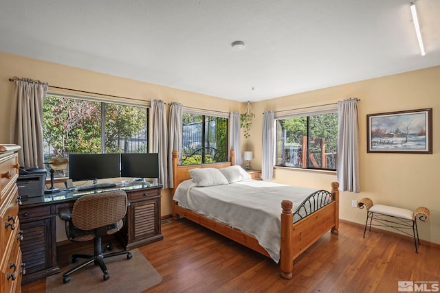 3075 Markridge Dr, Reno, NV 89509 - bedroom featuring wood finished floors, an office area, and baseboards