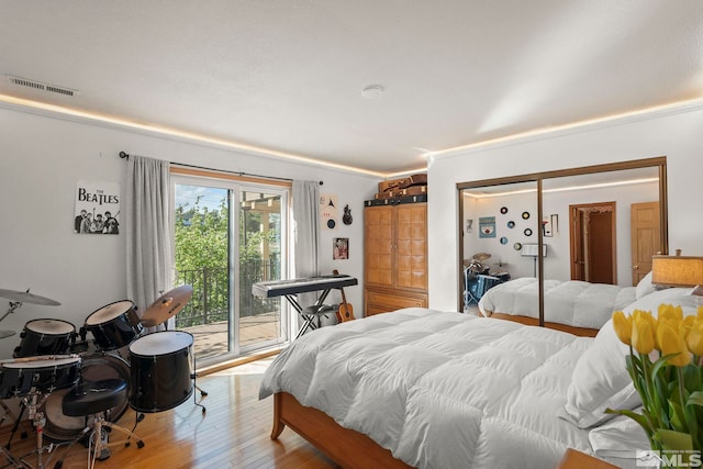 3075 Markridge Dr, Reno, NV 89509 - bedroom with access to exterior, wood finished floors, and a closet