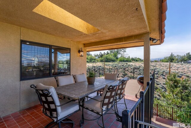 3075 Markridge Dr, Reno, NV 89509 - view of patio / terrace featuring outdoor dining space and a balcony