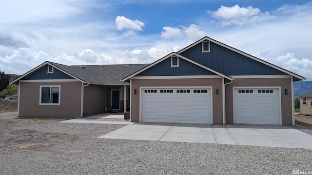 view of front of property with a garage and concrete driveway