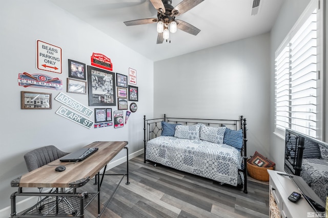 6650 Magical Dr, Sparks, NV 89436 - bedroom with multiple windows, wood finished floors, an office area, and ceiling fan