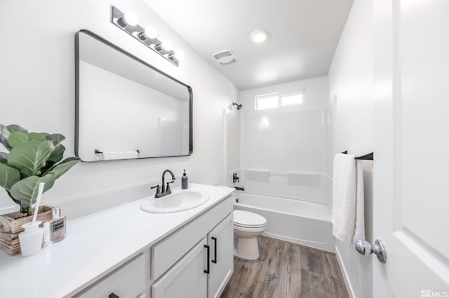8855 Wolf Moon Dr, Reno, NV 89506 - full bathroom featuring toilet, vanity, wood finished floors, and shower / bath combination