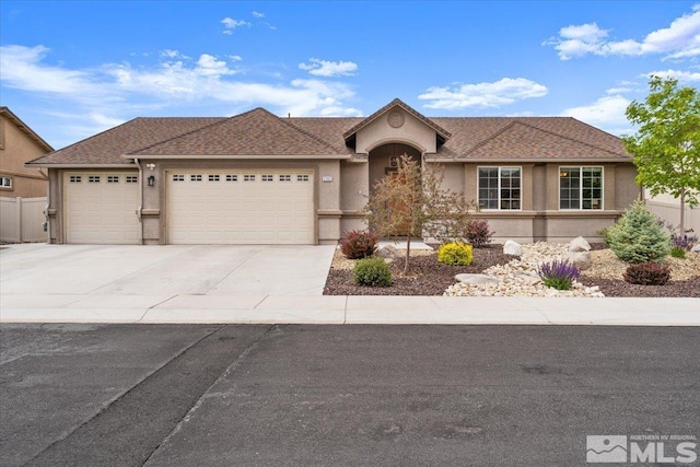 ranch-style house featuring an attached garage, stucco siding, and concrete driveway