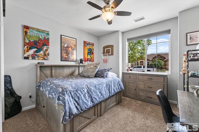bedroom with light carpet, baseboards, and ceiling fan