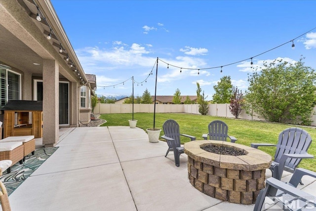 view of patio / terrace featuring a fire pit
