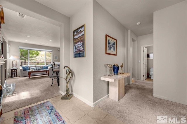 hall with carpet flooring, baseboards, and recessed lighting