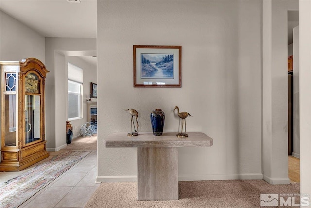 hallway featuring baseboards