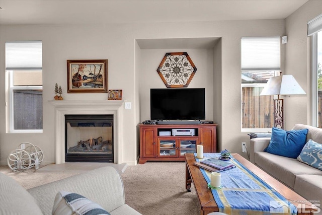living area with a glass covered fireplace