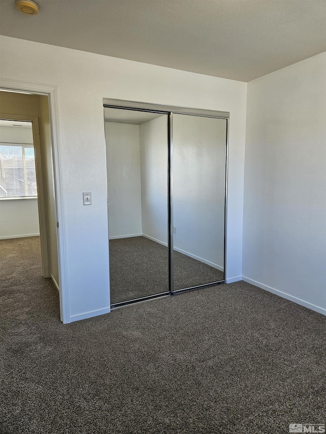 9995 Brightridge, Reno, NV 89506 - unfurnished bedroom featuring carpet floors, a closet, and baseboards