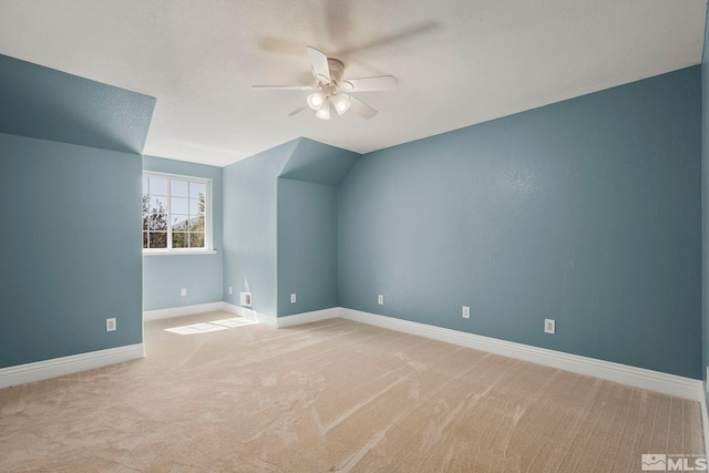 additional living space with ceiling fan, carpet flooring, and baseboards