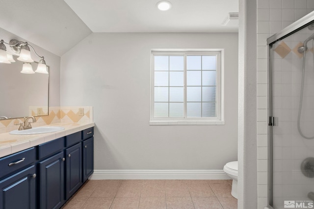 full bath with vanity, a tile shower, toilet, decorative backsplash, and tile patterned flooring