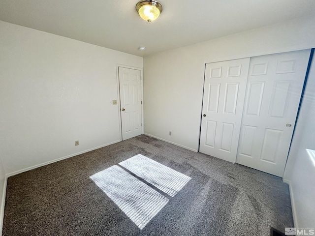 1447 N Marion Russell, Gardnerville, NV 89410 - unfurnished bedroom featuring carpet flooring, baseboards, and a closet