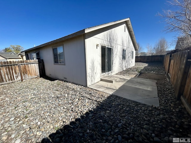 1447 N Marion Russell, Gardnerville, NV 89410 - back of property featuring a fenced backyard, a patio area, and crawl space