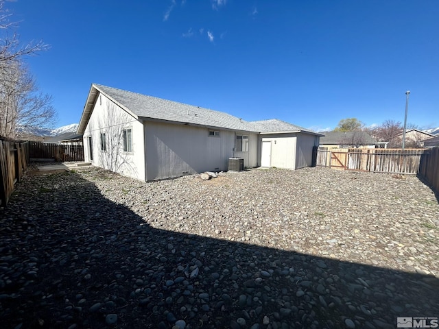1447 N Marion Russell, Gardnerville, NV 89410 - rear view of property with central AC unit and a fenced backyard
